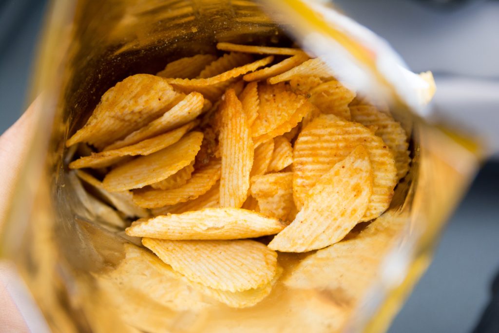 Close up view of the opening of a bag of Pringles chip