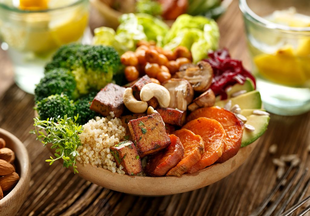 wooden bowl filled with vegetarian food