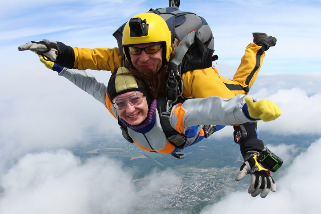 A man and woman skydiving together