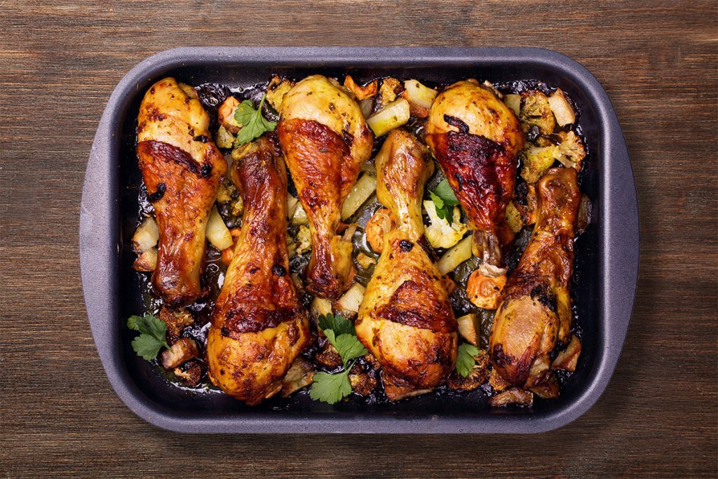 Top view of sheet pan chicken with vegetables