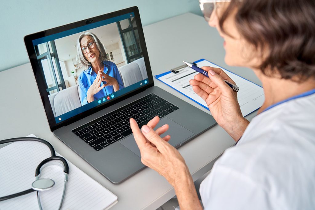 Woman having a online therapy session with doctor