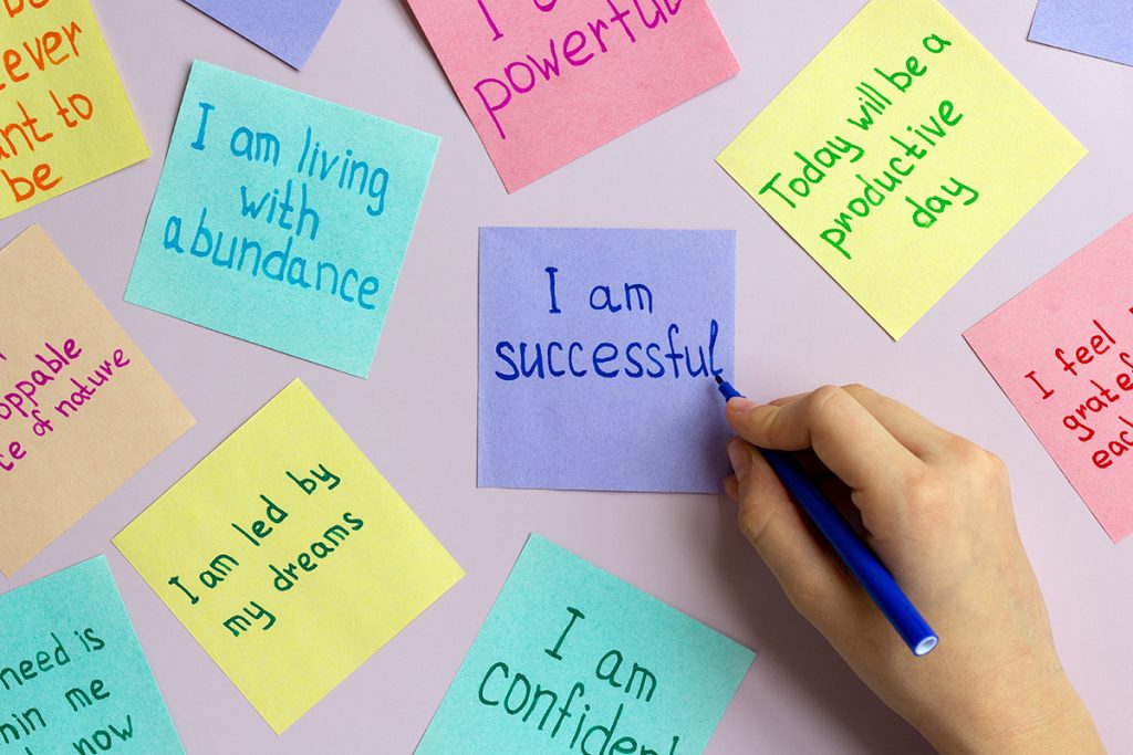 Positive affirmations written on stickie notes