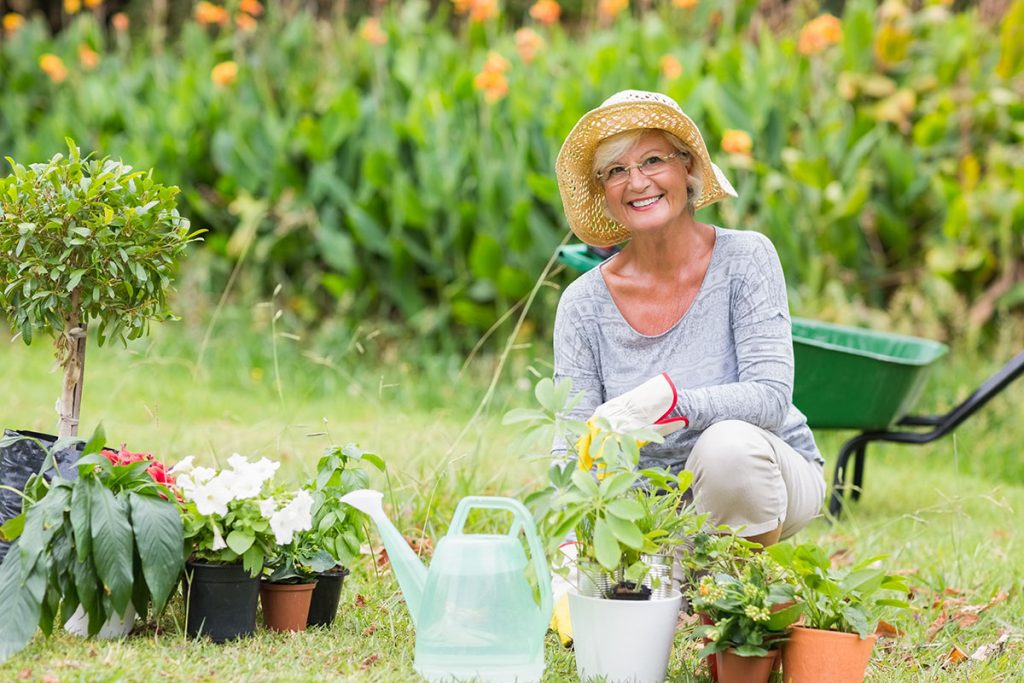 Happy woman gardening on a sunny day