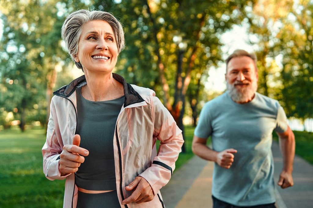 Older couple jogging in the morning together