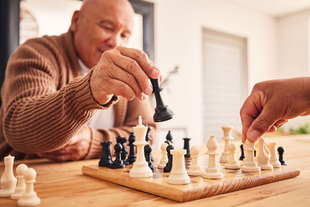Senior man playing game of chess