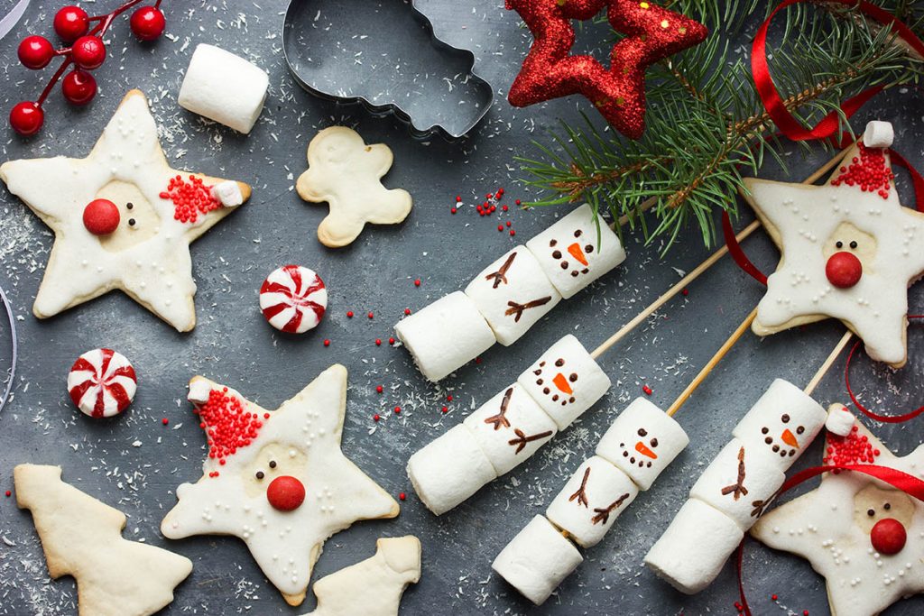 Christmas Sugar Cookies santa claus and Snowman marshmallow pops traditional sweet treats for the winter holidays