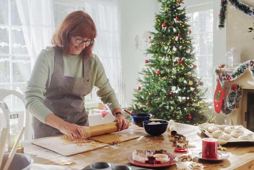 older woman baking during the holidays