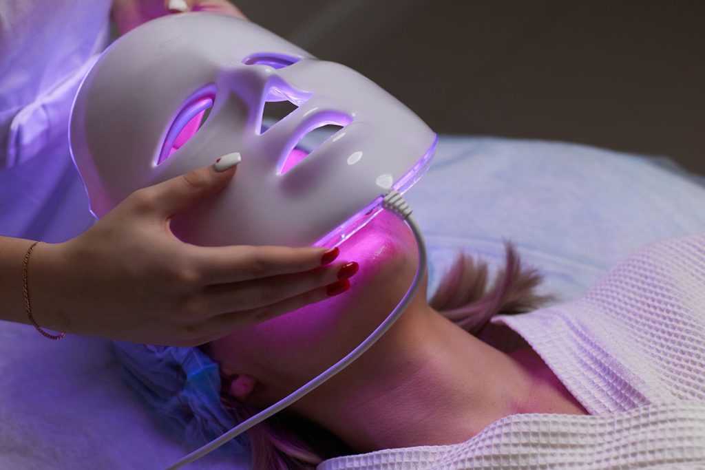 LED light anti-aging mask for facial skin care in a spa 