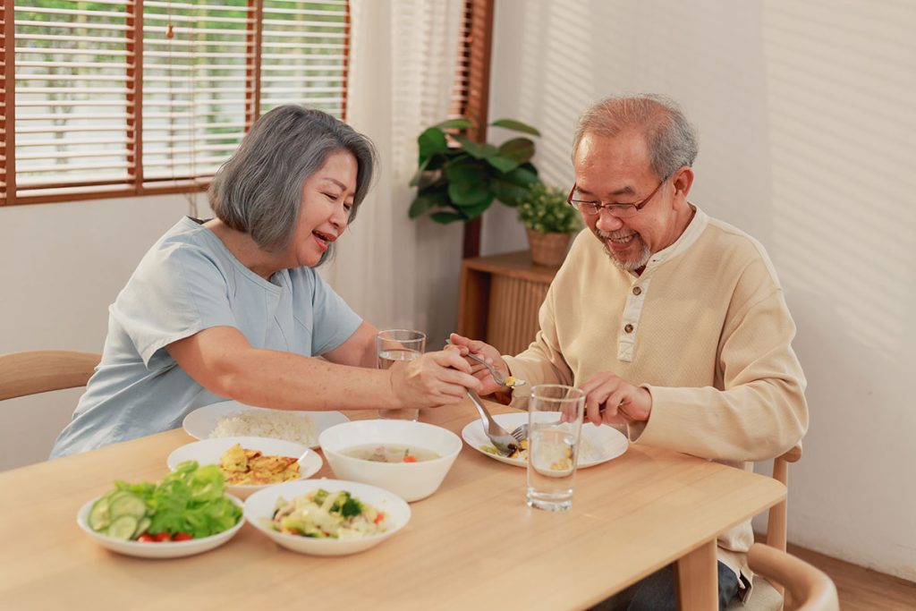 senior couple happy eating together