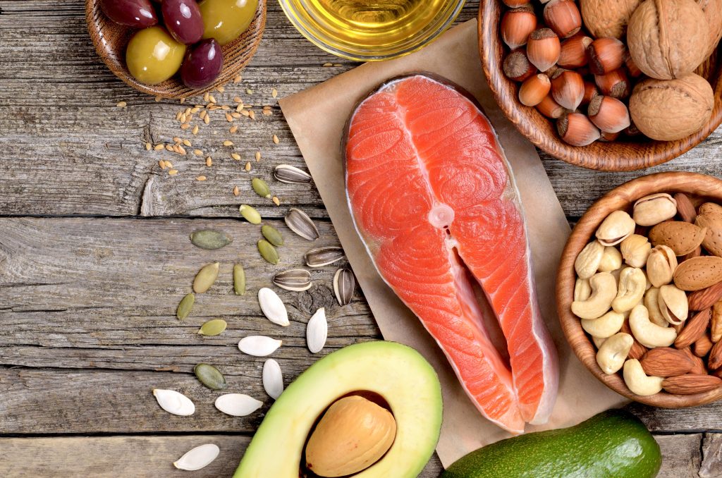 spread of healthy fats. Avocado, salmon, nuts, oil