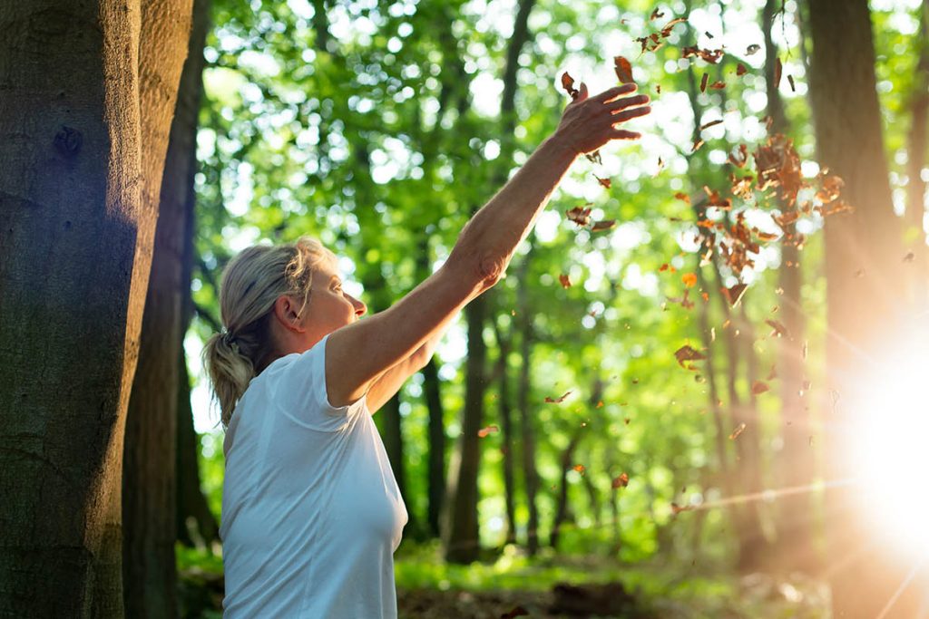 older woman forest bathing