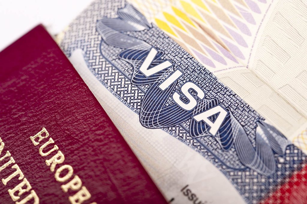 Close-up of american visa with european passport