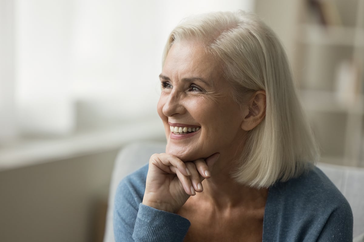 Older woman smiling looking to the side