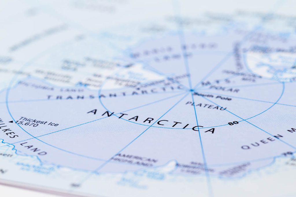 close up of a world map with the word Antartica in focus