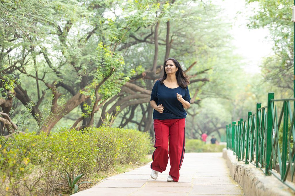 woman jogging at park.