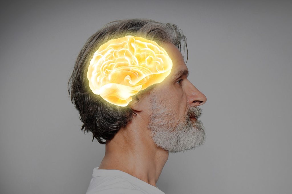 Thinking concept Mature man and illustrated brain on grey background